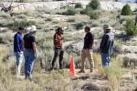 Chad Ollinger discusses drilling logistics with the team.