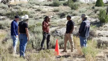 Chad Ollinger discusses drilling logistics with the team.