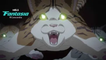 A cat lunges forward to the camera, its eyes are brightly lit.