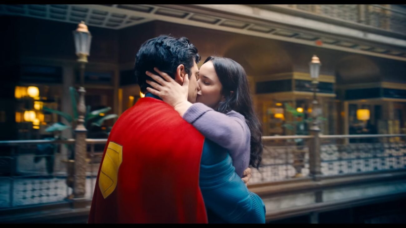 Superman and Los Lane kiss in the air in a mall
