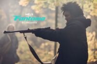 A woman holding a rifle in the woods (The Well