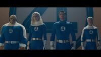 All members of The Fantastic Four standing in a line in their costumes