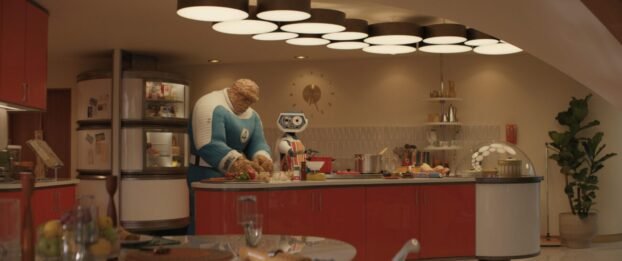 Ben Grimm/The Thing works at a counter fixing dinner with the robot, H.E.R.B.I.E.