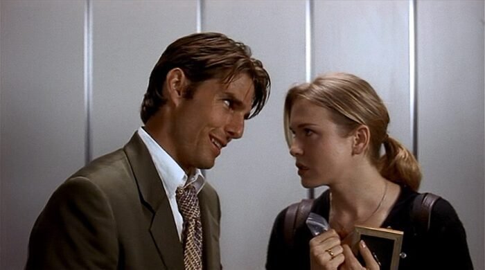 A man and woman talk in an elevator in Jerry Maguire