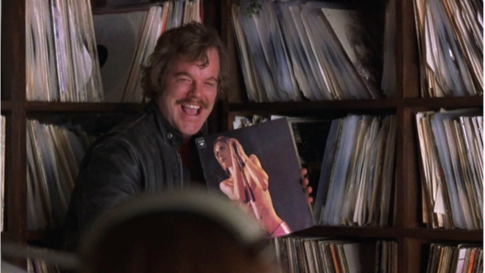 Lester holding a vinyl in the Cameron Crowe film Almost Famous