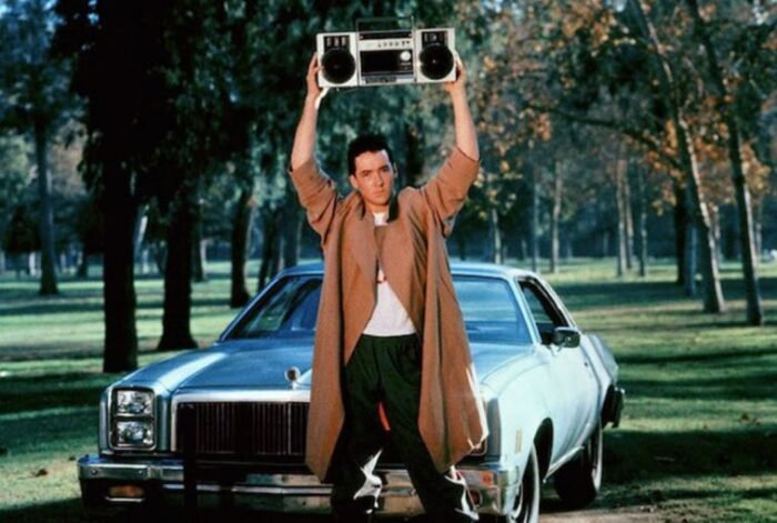 Cusack holding up boombox in iconic scene in the Cameron Crowe film Say Anything...