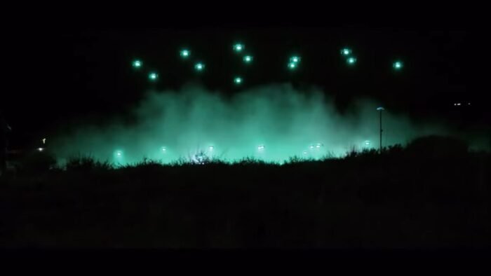 A set of green drones lift off from the East Field
