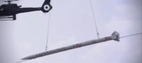 The DART is being lifted into the sky by Helicopter 1