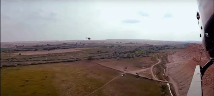 Helicopter 1 films Helicopter 2 above the ranch (Skinwalker Ranch: “Darting Around.”)