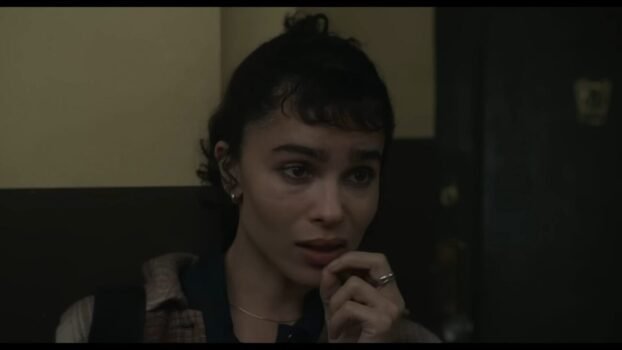 Yvonne (Zoe Kravits) looks ahead at the camera.