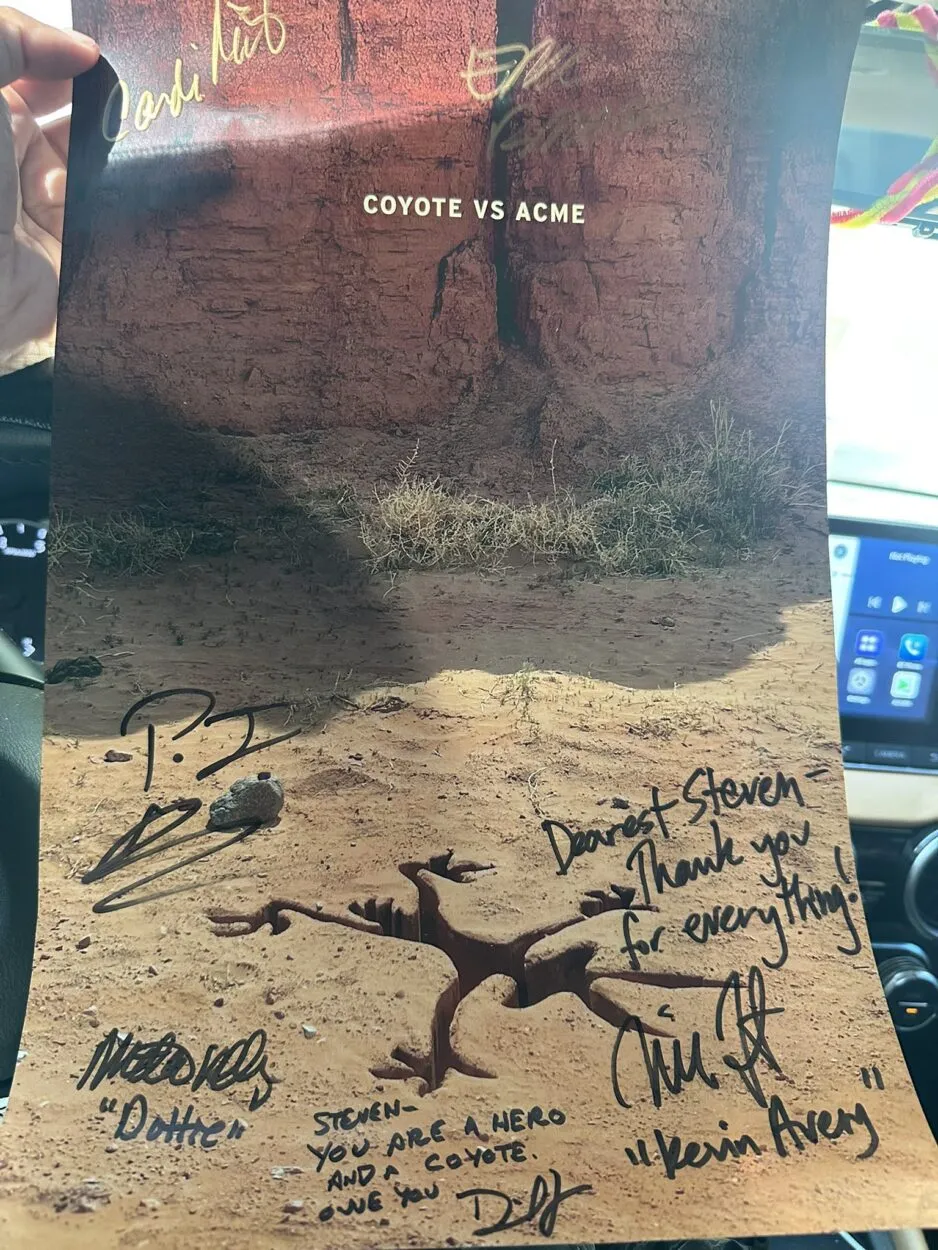 A poster for the film, “Coyote vs. Acme” (2026), signed to Steven Ray Byrd by Candi Milo, Eric Bauza, P.J. Byrne, Martha Kelly, Dave Green, and Will Forte.