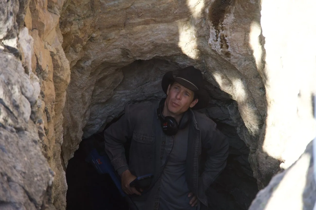 Josh Feldman pops out of an abandoned mine as he uses the metal detector.