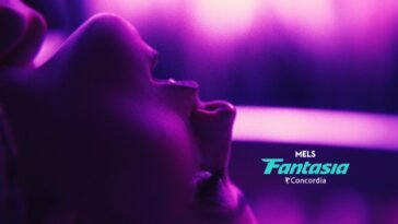 A woman with her back and eyes shut under purple lighting (Touch Me)