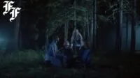 an enchanted forest scene of a group of women.
