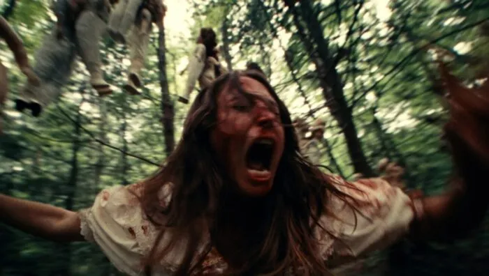 A woman runs through the forest screaming (Fantastic Fest / Dolly)