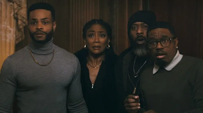 A group of four people who look scared.