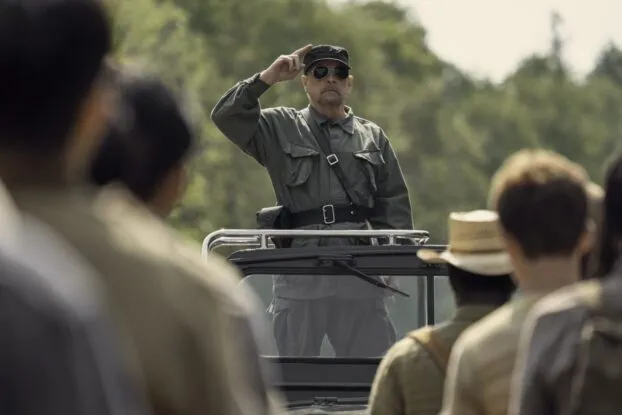 Mark Hamill plays the Major. He gives a two-fingered-salute to the boys in front of him as he stands on a vehicle.