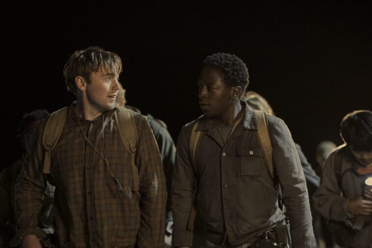 Ray and McVries talk to each other in the dead of the night as they walk.
