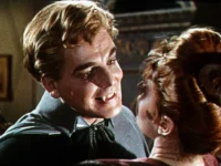 Dracula shows a woman his fangs