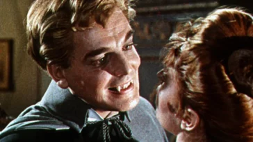 Dracula shows a woman his fangs