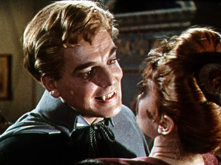 Dracula shows a woman his fangs