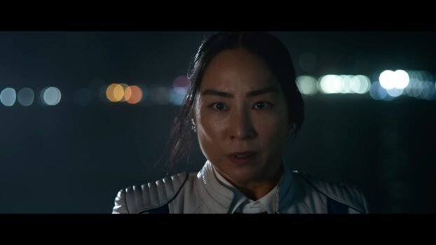Eve Kim (Greta Lee) looking at the camera.