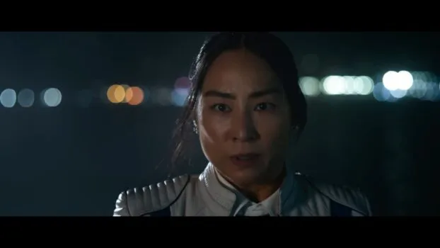 Eve Kim (Greta Lee) looking at the camera.