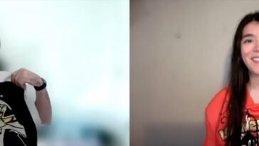 Alexis Bonhomme holds up a black and white bomber jacket featuring the Road Runner and Wile E. Coyote while talking to Jamie Lee, wearing an orange Looney Tunes hoodie featuring Wile E. Coyote and Road Runner, a Daffy Duck key chain tied to one string on the hoodie.