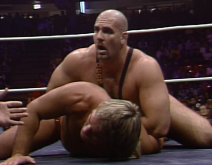 Nikita Koloff has Terry Taylor on the mat with a hammerlock at Starrcade '87