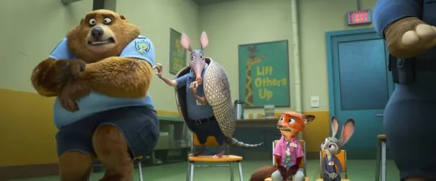 Nick and Judy sit in chairs next to armadillo who is picking a bear's hair. They are in buddy counseling.