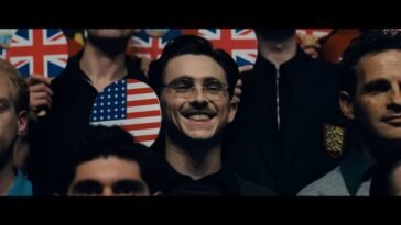 Marty holds the U.S. Ping Pong Paddle and smiles for a group picture.